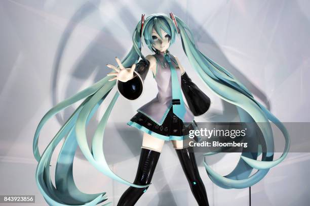 Figure of Hatsune Miku, a virtual pop star and the voice behind Crypton Future Media Inc.'s vocal synthesizer software, stands on display during the...