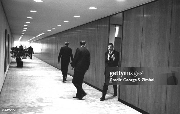David Rockefeller Sr. Walks out into the hallways of the Chase Manhattan offices, 1960s. New York.