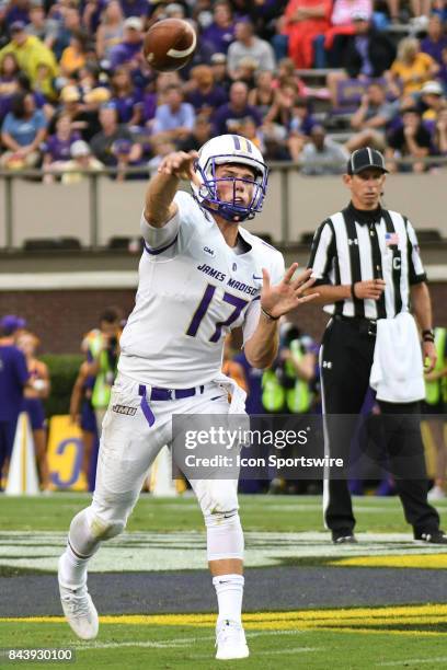 Quarterback Bryan Schor of the James Madison Dukes*throws a pass during a game between the James Madison Dukes and the East Carolina Pirates on...
