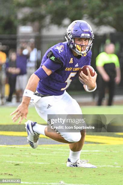Quarterback Gardner Minshew of the East Carolina Pirates scrambles with the ball during a game between the James Madison Dukes and the East Carolina...
