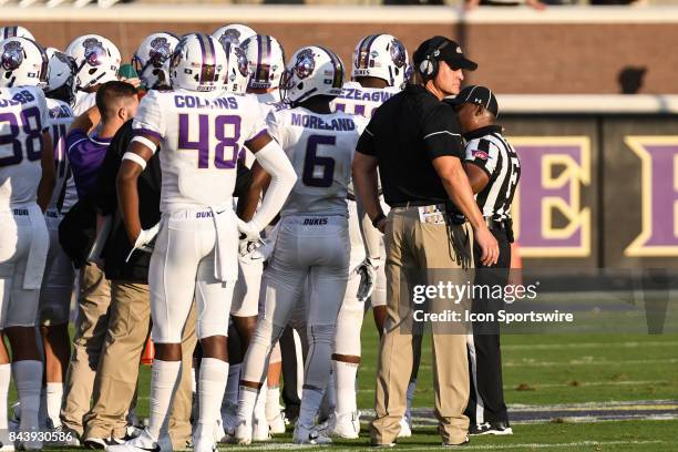 James Madison Dukes head coach Mike Houston looks on during a time out during a game between the James Madison Dukes and the East Carolina Pirates on...