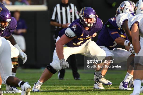 Offensive lineman Austin Lee of the East Carolina Pirates looks for a block during a game between the James Madison Dukes and the East Carolina...