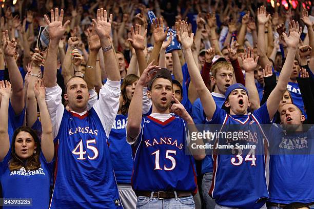 Fans of the Kansas State Wildcats hold up their arms during the game against the Kansas Jayhawks on January 13, 2009 at Allen Fieldhouse in Lawrence,...