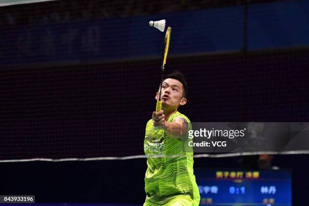 Lin Dan competes during the Men's singles badminton final match against Shi Yuqi on day twelve of the 13th Chinese National Games on September 8,...