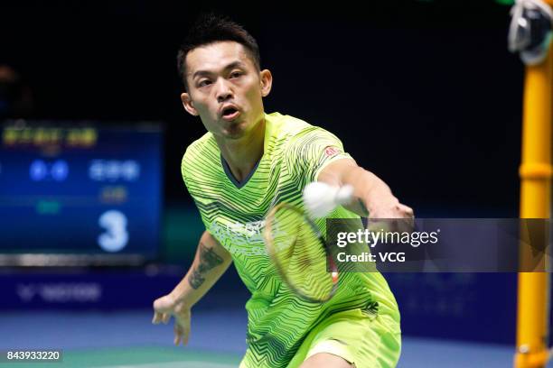 Lin Dan competes during the Men's singles badminton final match against Shi Yuqi on day twelve of the 13th Chinese National Games on September 8,...