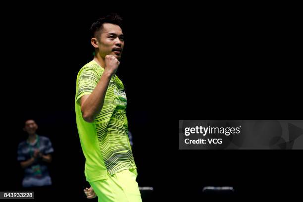 Lin Dan celebrates after winning the Men's singles badminton final match against Shi Yuqi on day twelve of the 13th Chinese National Games on...