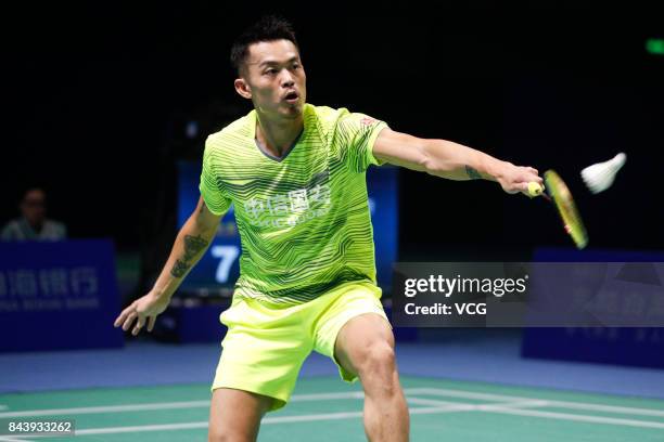 Lin Dan competes during the Men's singles badminton final match against Shi Yuqi on day twelve of the 13th Chinese National Games on September 8,...