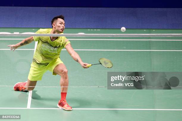 Lin Dan competes during the Men's singles badminton final match against Shi Yuqi on day twelve of the 13th Chinese National Games on September 8,...