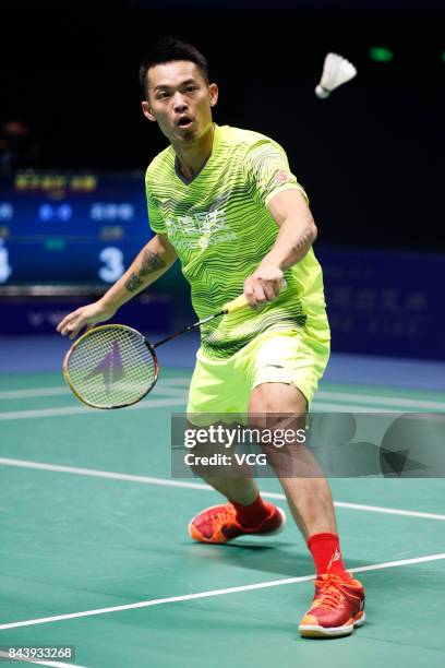 Lin Dan competes during the Men's singles badminton final match against Shi Yuqi on day twelve of the 13th Chinese National Games on September 8,...