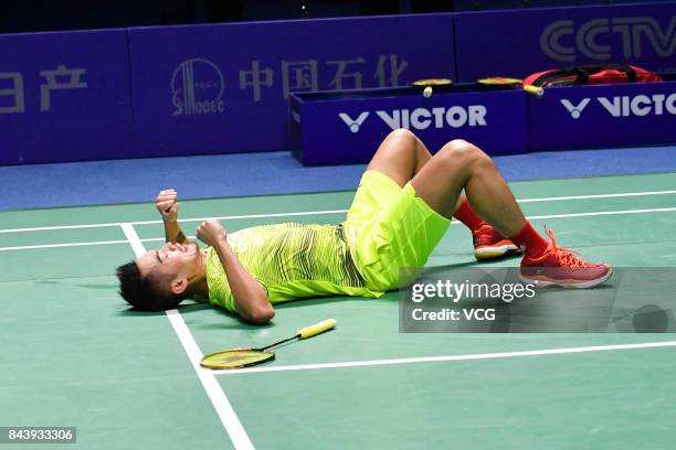 Lin Dan celebrates after winning the Men's singles badminton final match against Shi Yuqi on day twelve of the 13th Chinese National Games on...