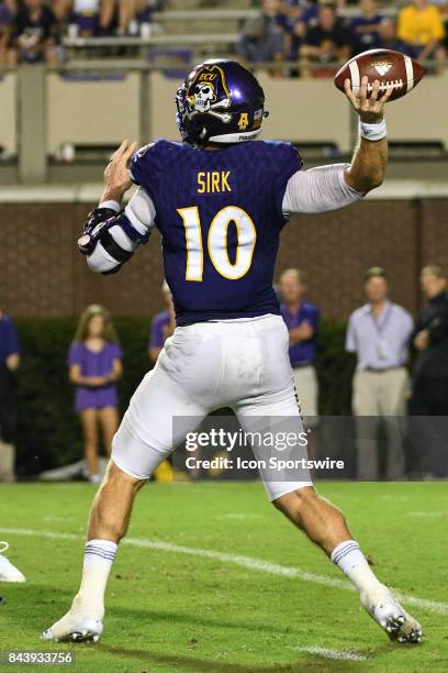 Quarterback Thomas Sirk of the East Carolina Pirates throws a pass during a game between the James Madison Dukes and the East Carolina Pirates on...