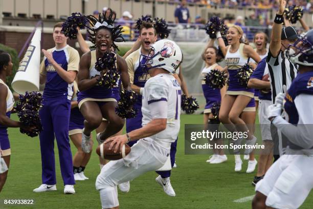 James Madison Dukes cheerleaders celebrate a touchdown by quarterback Bryan Schor of the James Madison Dukes during a game between the James Madison...