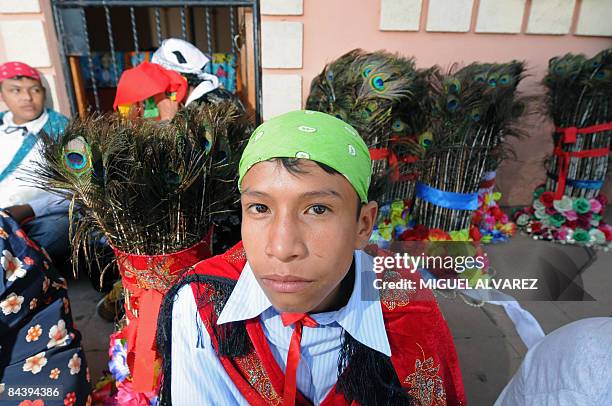 By Julia Rios - A boy poses for a picture as he takes a rest on January 19 during the festivity of San Sebastian in Diriamba, province of Carazo,...