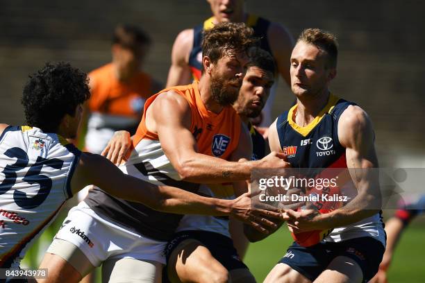 Dawson Simpson of the Giants and Damon Hill of the Crows compete for the ball during a practice match between the Greater Western Sydney Giants and...