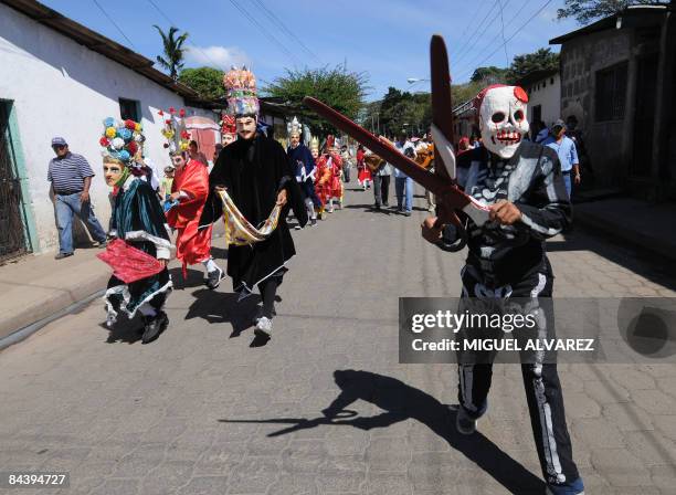 By Julia Rios - A dancer dressed as "The Death" takes part in the traditional dances "El Macho Raton", "El Toro Huaco" and "El Gueguense" on January...