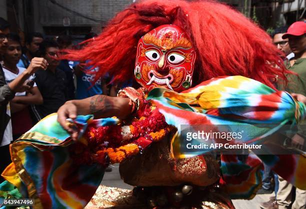 This photograph taken on September 3, 2017 shows Nepali Lakhe dancer Laxman Ranjit performing the "Lakhe" dance in Kathmandu. Kathmandu's feared...