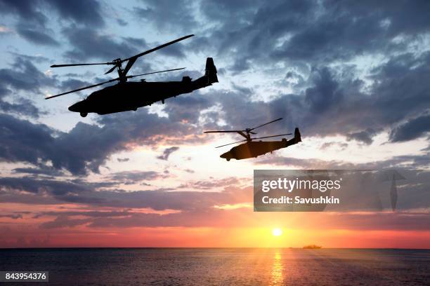 two military helicopter - army missile stock pictures, royalty-free photos & images