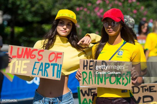 Models Sofia Resing and Lais Ribeiro are seen during a protest to save the Amazon rainforest in Union Square on September 7, 2017 in New York City.