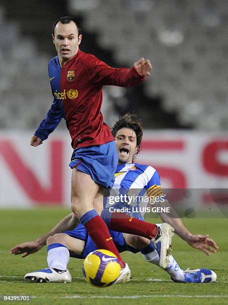 Barcelona's Spanish midfielder Andrés Iniesta fights for the ball with Espanyol´s Jarque during the King's Cup football match at the Olympic Stadium...