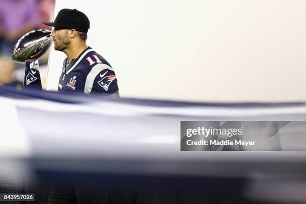 Julian Edelman of the New England Patriots stands with the Vince Lombardi Trophy prior to the game between the Kansas City Chiefs and the New England...