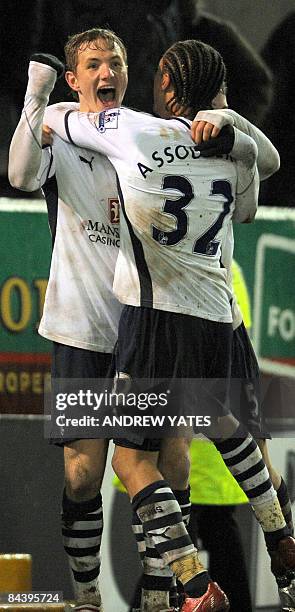 Tottenham Hotspur's Russian forward Roman Pavlyuchenko celebrates with Tottenham Hotspur's Cameroonian defender Benoît Assou-Ekotto after scoring in...