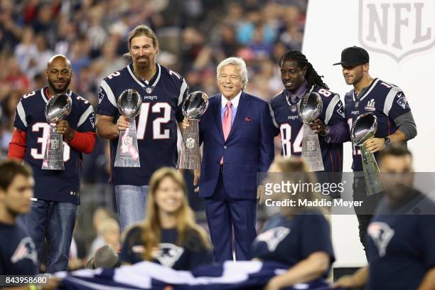 Former New England Patriots players Kevin Faulk, Matt Light and Deion Branch pose with New England Patriots owner Robert Kraft and Julian Edelman to...