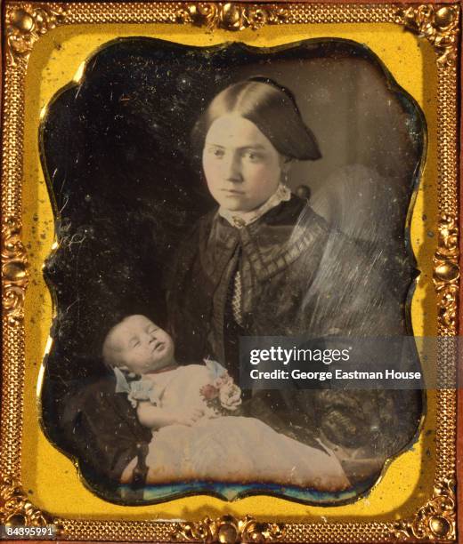 Post-mortem portrait shows a woman holding her baby, ca. 1855. United States.