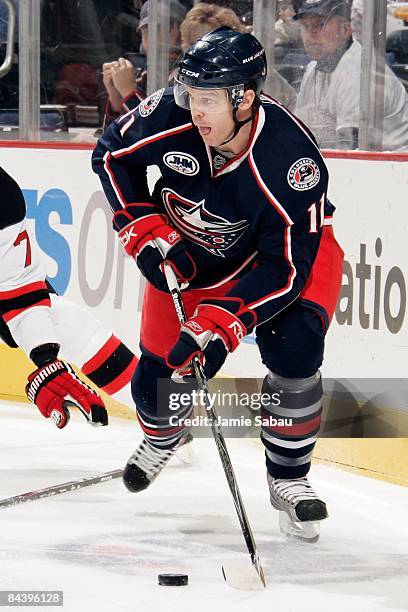 Forward Craig MacDonald of the Columbus Blue Jackets skates with the puck against the New Jersey Devils on January 16, 2009 at Nationwide Arena in...