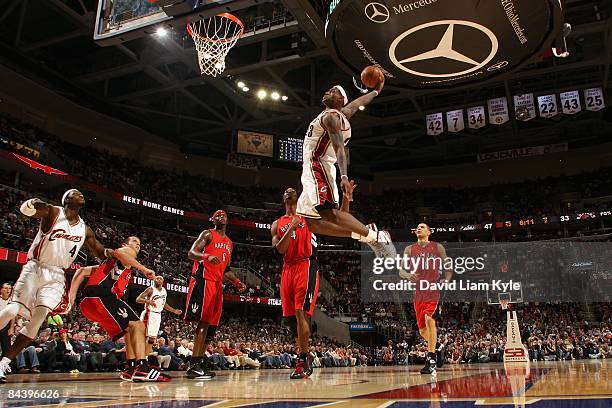 LeBron James of the Cleveland Cavaliers goes for the dunk against the Toronto Raptors during the game on December 9, 2008 at Quicken Loans Arena in...