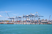 Auckland port with shipping containers, cranes and ship in New Zealand, NZ