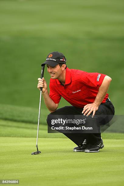 Mike Weir of Canada lines up his putt on the eighth hole on the Palmer Private Course at PGA West during the first round of the Bob Hope Chrysler...