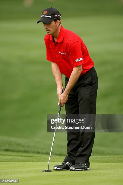 Mike Weir of Canada lines up his putt on the eighth hole on the Palmer Private Course at PGA West during the first round of the Bob Hope Chrysler...