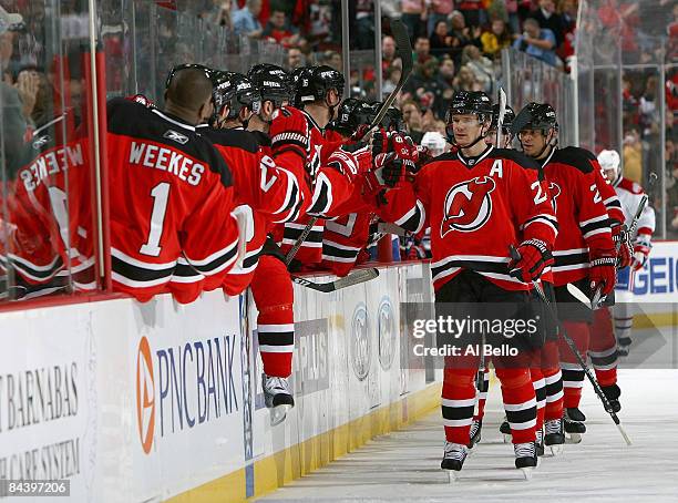 Patrik Elias of the New Jersey Devils celebrates a goal by Paul Martin against the Montreal Canadiens during their game on January 21, 2009 at The...