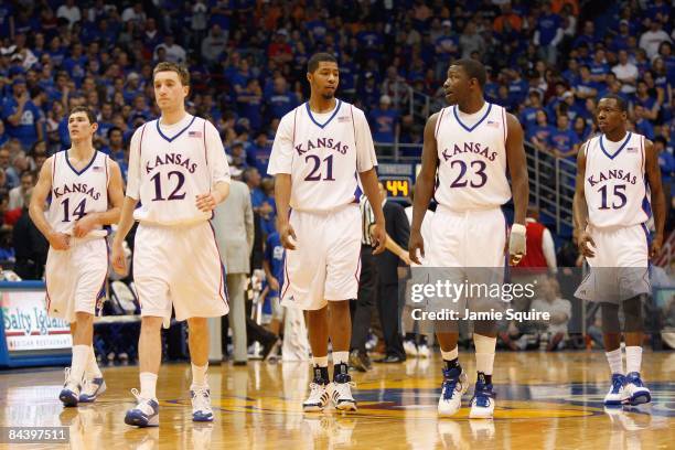 Tyrel Reed, Brady Morningstar, Markieff Morris, Mario Little and Tyshawn Taylor of the Kansas Jayhawks walks on the court against the Tennessee...