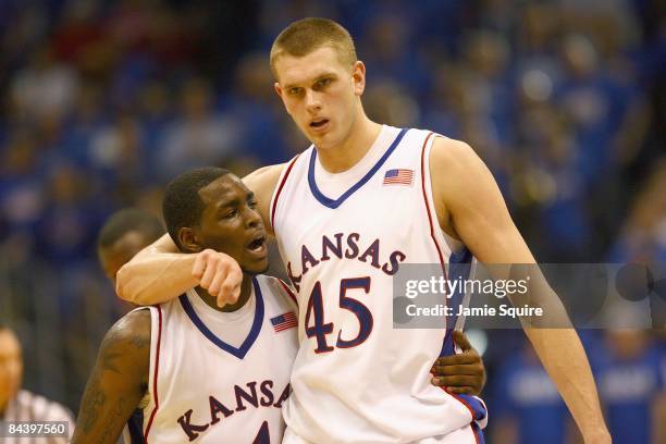 Sherron Collins and Cole Aldrich of the Kansas Jayhawks walk on court against the Tennessee Volunteers on January 3, 2009 at Allen Fieldhouse in...