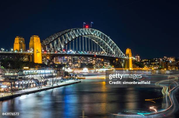 lights of sydney's circular quay at night - sydney harbour boats stock pictures, royalty-free photos & images