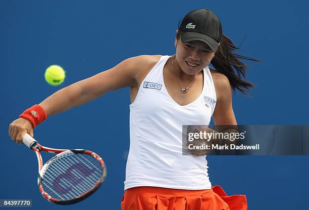 Yung-Jan Chan of Chinese Taipei plays a backhand in her second round match against Dominika Cibulkova of Slovakia during day four of the 2009...