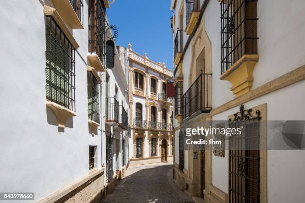 typical facades and street in a "white village" in andalusia (ronda/ andalusia/ spain) - ronda fotografías e imágenes de stock