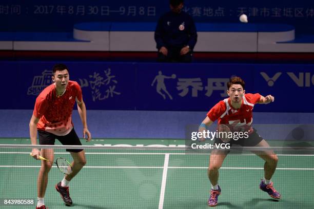 Hong Wei and Chai Biao compete against Wang Yiilv and Liu Cheng during the Men's doubles badminton final match during the 13th Chinese National Games...