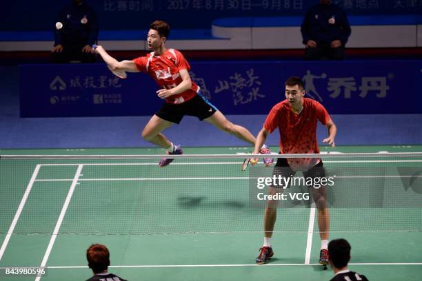 Hong Wei and Chai Biao compete against Wang Yiilv and Liu Cheng during the Men's doubles badminton final match during the 13th Chinese National Games...