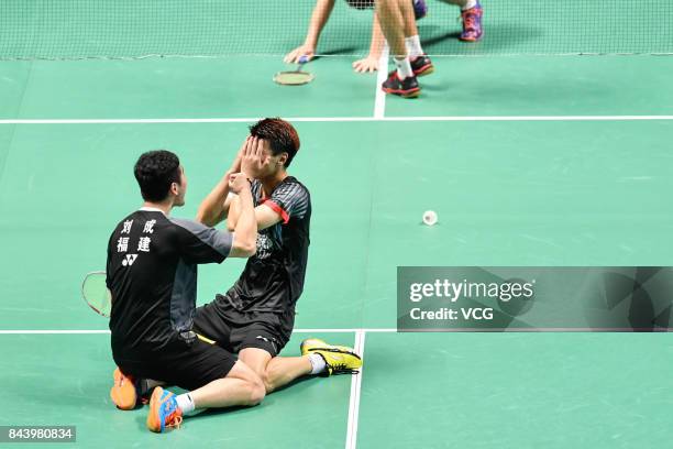 Wang Yiilv and Liu Cheng celebrate after winning the Men's doubles badminton final match against Hong Wei and Chai Biao during the 13th Chinese...