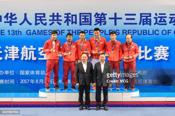 Lin Dan stands on the podium after winning the Men's singles badminton final match against Shi Yuqi on day twelve of the 13th Chinese National Games...