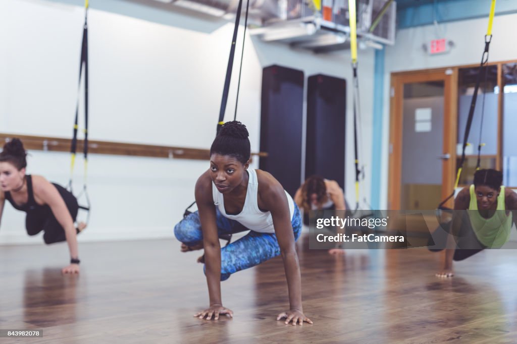 Group of Women Doing TRX Workout