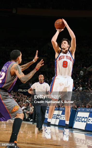 Danilo Gallinari of the New York Knicks shoots against Matt Barnes of the Phoenix Suns at Madison Square Garden January 21, 2009 in New York City....