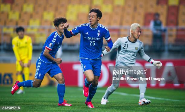 Suwon Samsung FC midfielder Yeom Ki Hun celebrates after scoring his goal during the 2015 AFC Champions League Round of 16 1st Leg match between...