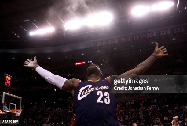 LeBron James of the Cleveland Cavaliers throws talcum powder in the air before the start of the game against the Portland Trail Blazers at the Rose...