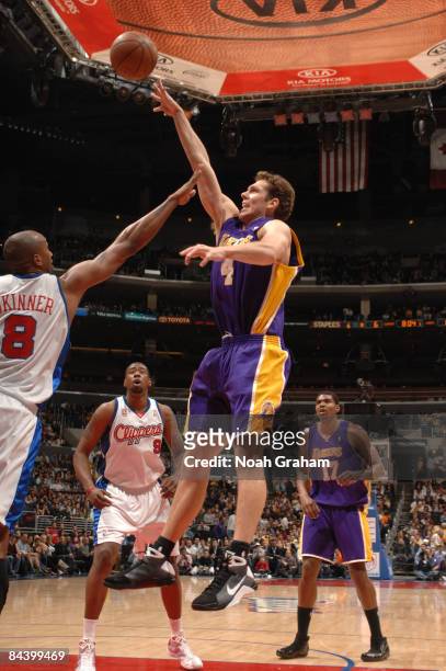 Luke Walton of the Los Angeles Lakers puts up a shot over Brian Skinner of the Los Angeles Clippers at Staples Center on January 21, 2009 in Los...
