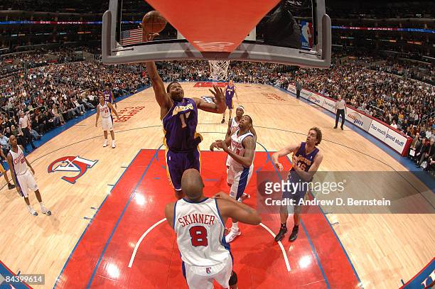 Andrew Bynum of the Los Angeles Lakers goes up for a shot against Brian Skinner of the Los Angeles Clippers at Staples Center on January 21, 2009 in...