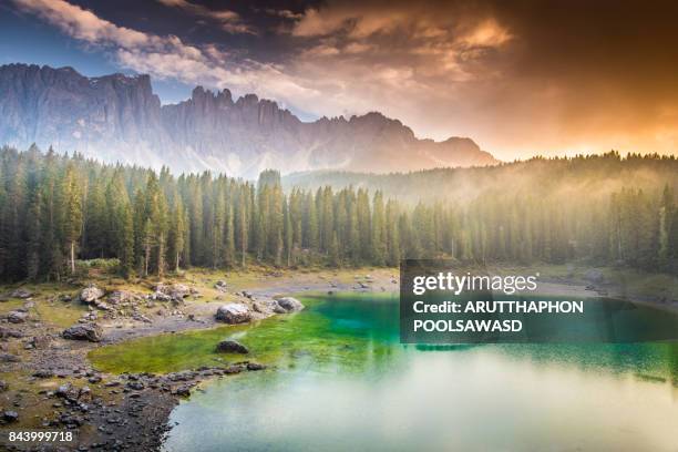 Carezza lake sunrise on the reflection lake , dolomite Italy , South tyrol