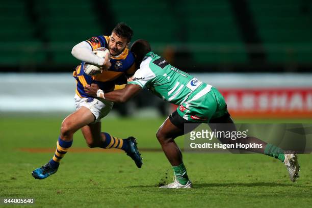 Chase Tiatia of Bay of Plenty is tackled by Willy Ambaka of Manawatu during the round four Mitre 10 Cup match between Manawatu and Bay of Plenty at...
